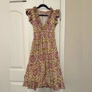 Floral Ruffle Midi Dress. Side zipper. Low cut front. Has pockets. Fits size 6.